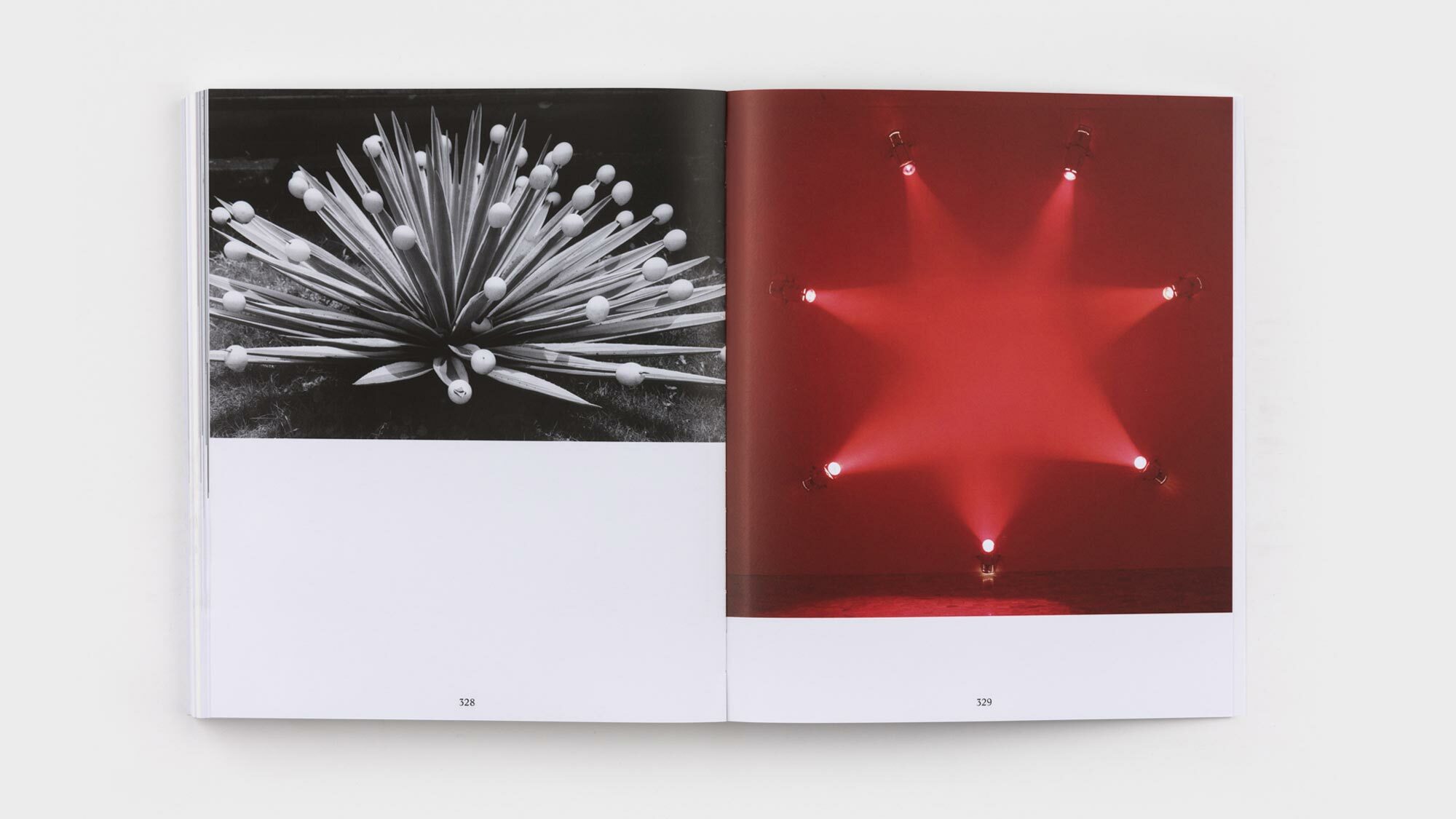 Pages 328 and 329. Filling the top-half of 328 is a black and white photograph by François of a low, spiky plant with eggs on the tips of its leaves. An image of one of Janssen's light works—seven spotlights forming a star of crimson—fills the top two-thirds of 329.