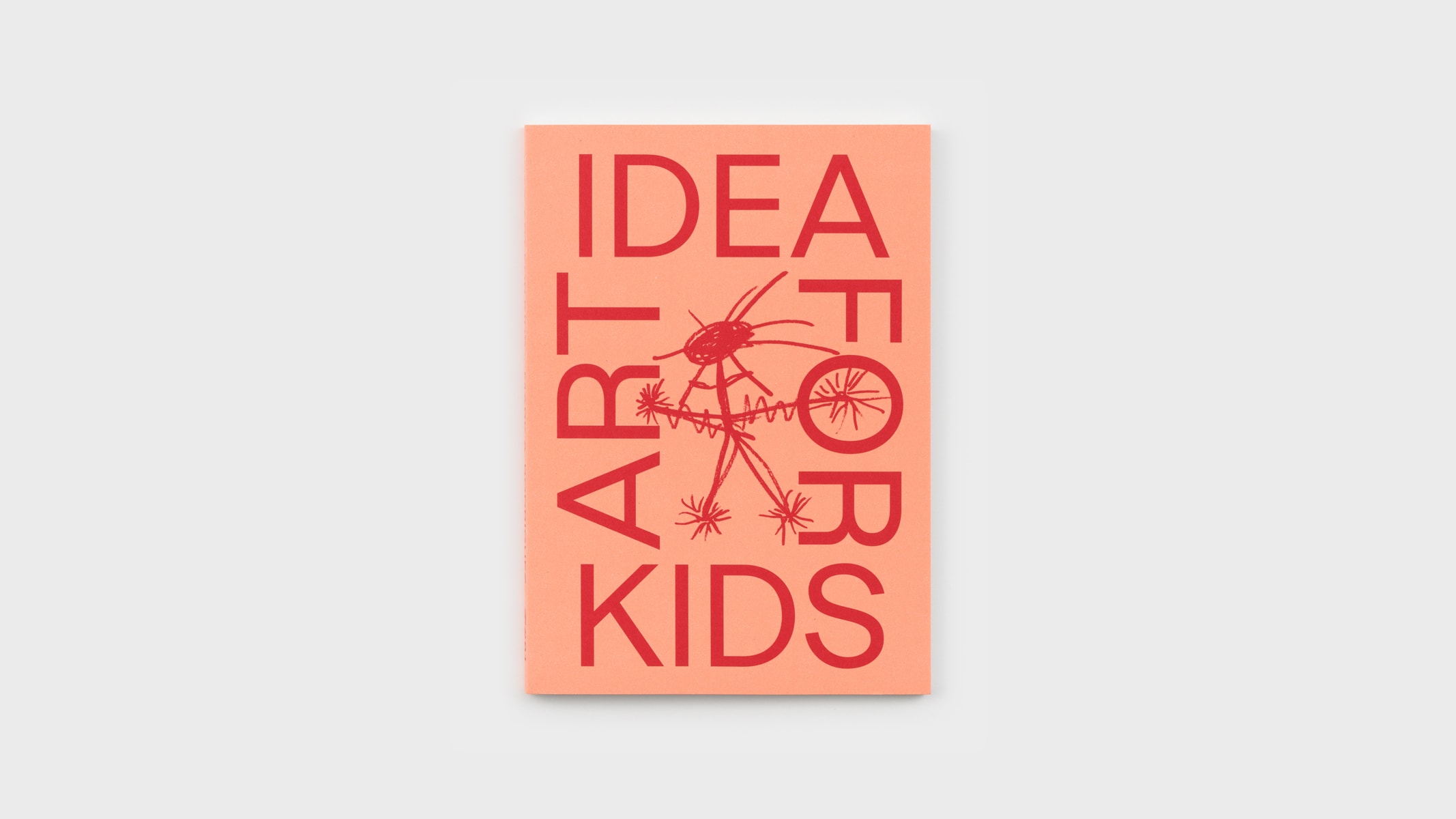 A photograph of the front cover of Idea Art for Kids. The title is arranged as a square, with 'Idea' at the top, 'For' on the right, 'Art' on the left, and 'Kids' on the bottom. In the middle is a child's drawing of an extraterrestrial stick figure.