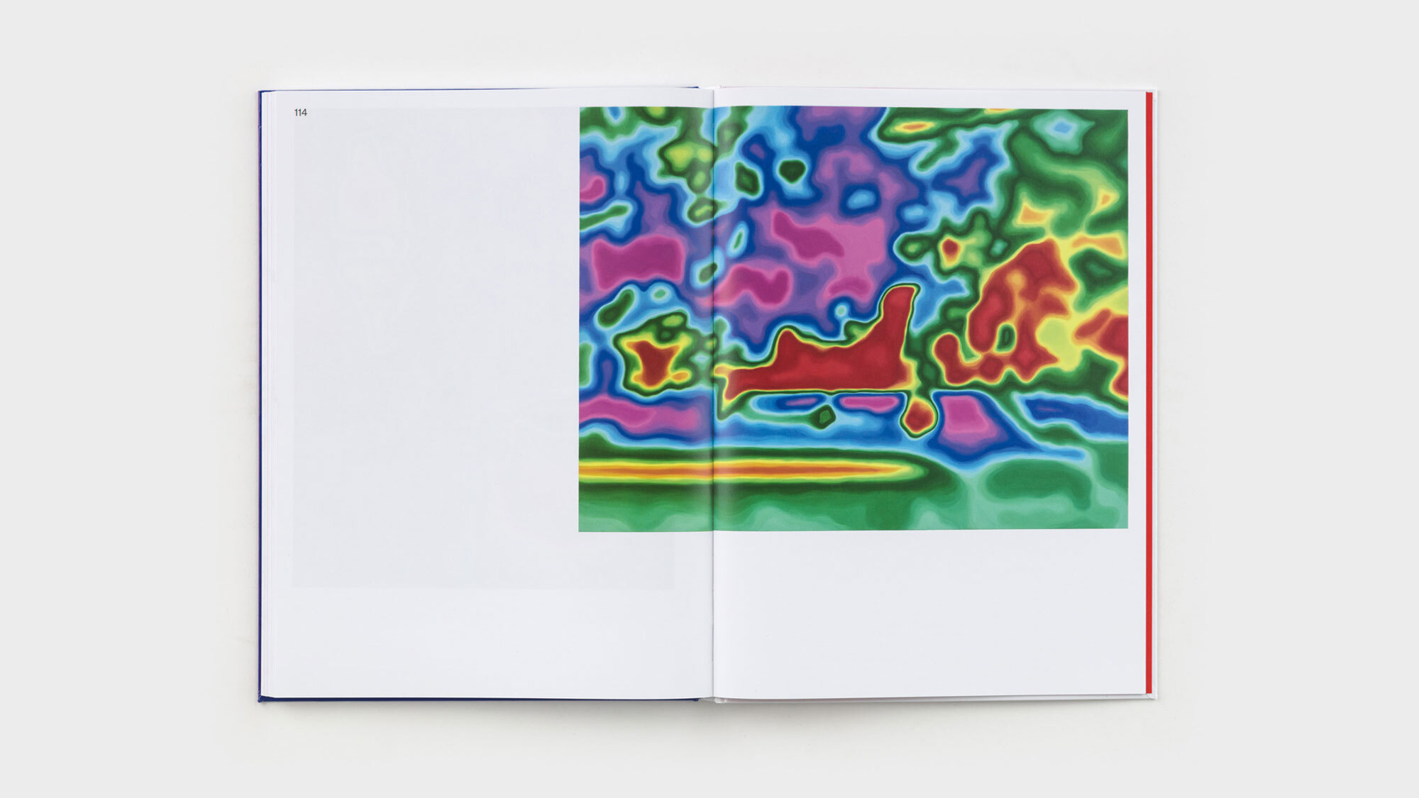 Pages 114 and 115. A single thermal-image painting, resembling technicolor camouflague, runs from the right edge, across the spine, and onto a third of the left-hand page.