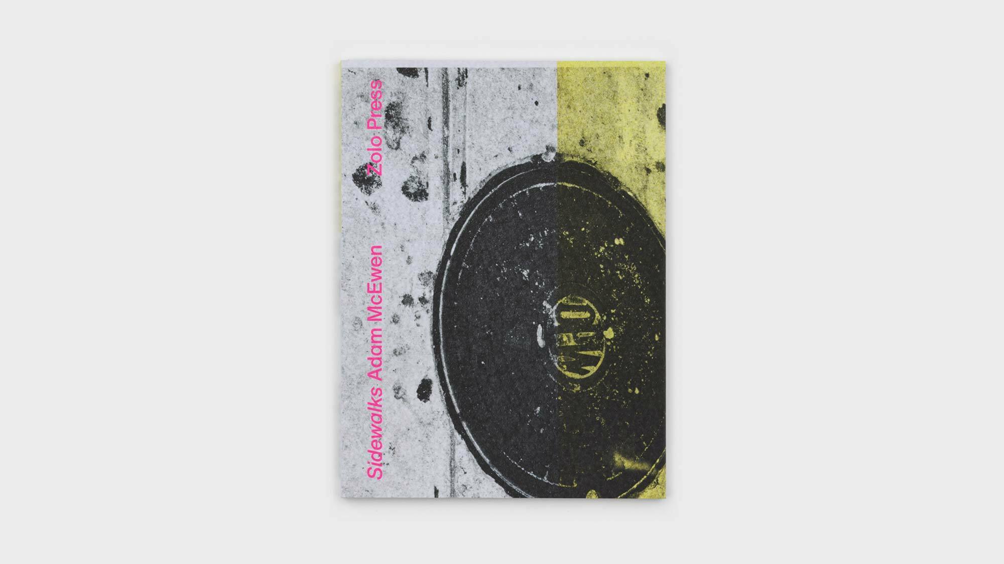A photograph of the front cover of Sidewalks on a light grey background. The title, Sidewalks,author, Adam McEwen, and Publisher, Zolo Press, are printed in light pink geometric sans-serif type atop a black-and-white image of pavent with a manhole cover and scattered flecks of spit-out gum.