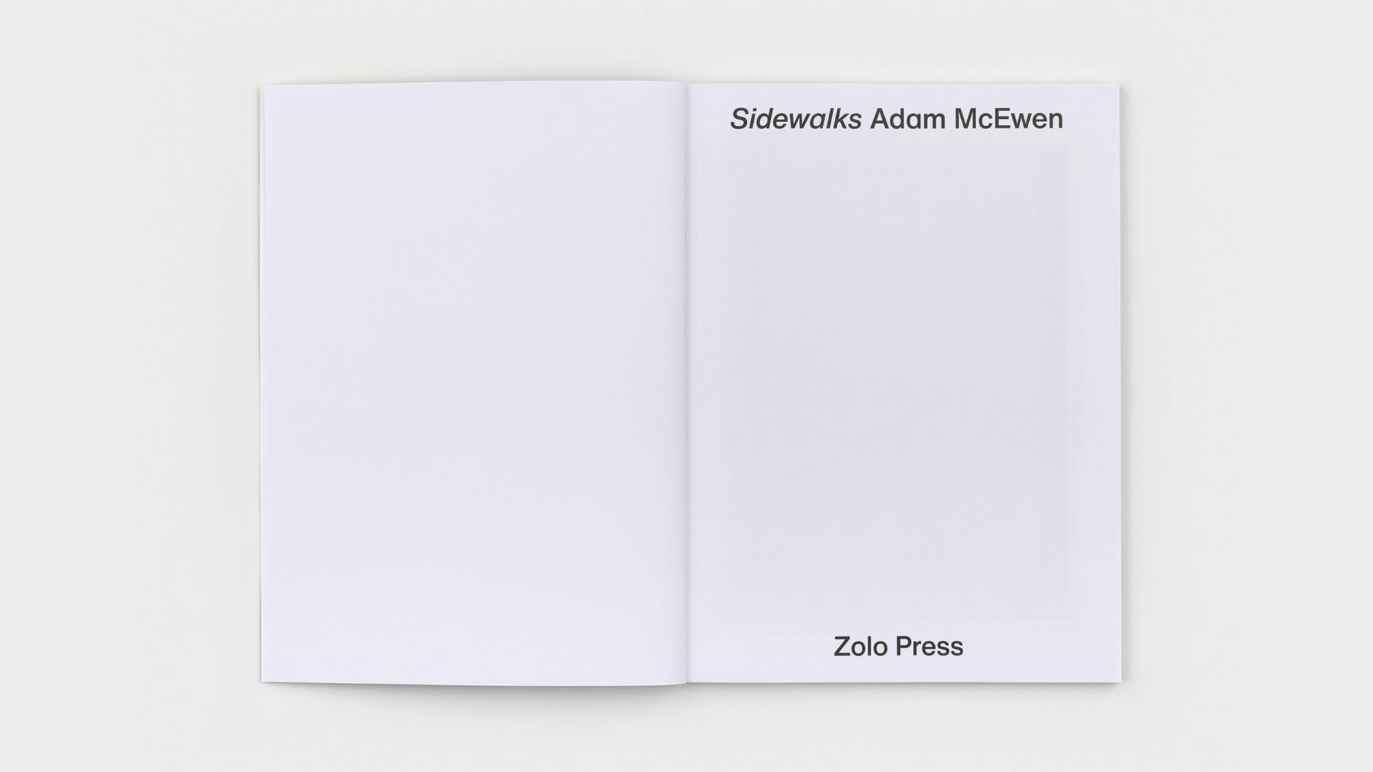 The book's inside cover. The left page is blank. The right lists, again, the title, author, and publisher—this time in larger black type.